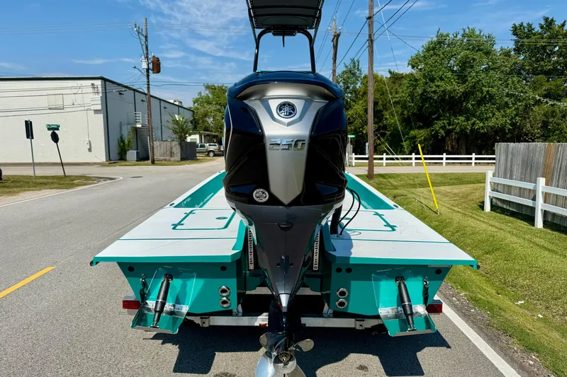 Slide: The Image of 2026 SCB R24 boat with powerful outboard motor on a sunny street. - 3