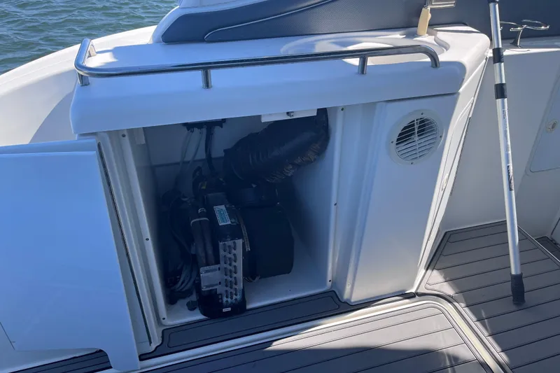 Slide: The Image of 2007 Cruisers Yachts 370 Express engine compartment with open hatch, showing internal components. - 10