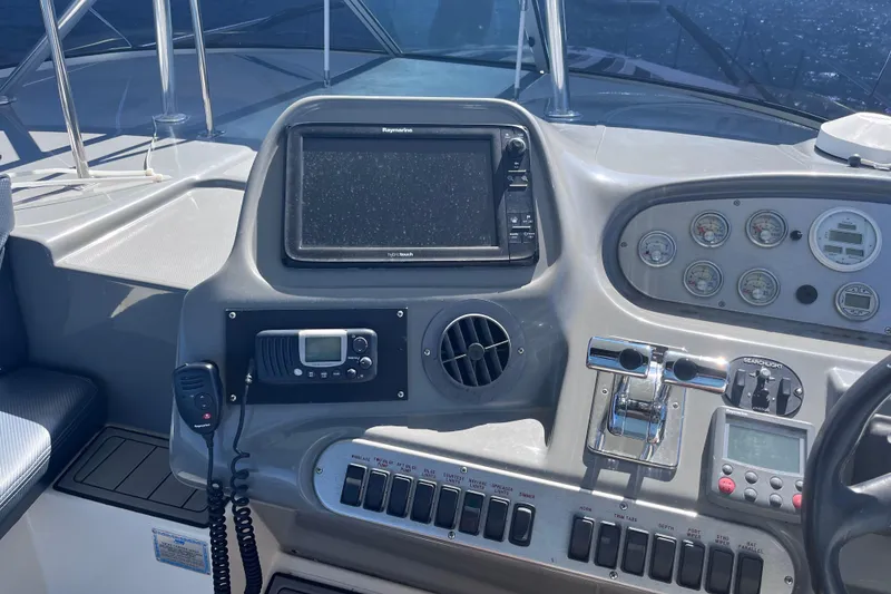 Slide: The Image of Control panel of 2007 Cruisers Yachts 370 Express with navigation and communication equipment. - 15