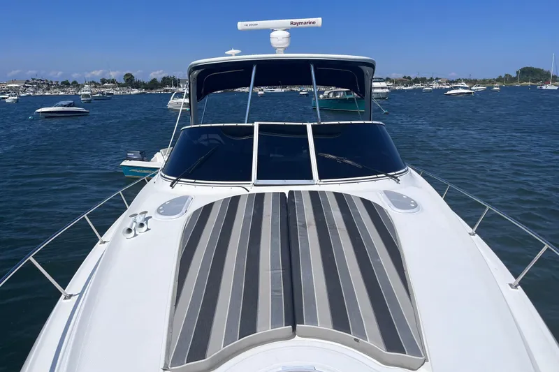Slide: The Image of 2007 Cruisers Yachts 370 Express on water, featuring sleek design and spacious deck. - 30