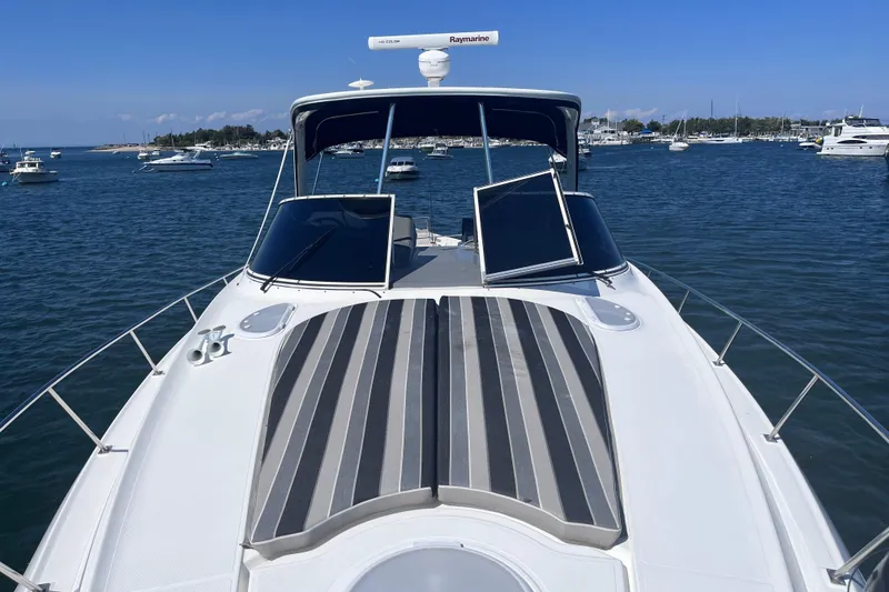 Slide: The Image of 2007 Cruisers Yachts 370 Express on water, featuring sleek design and spacious deck. - 31