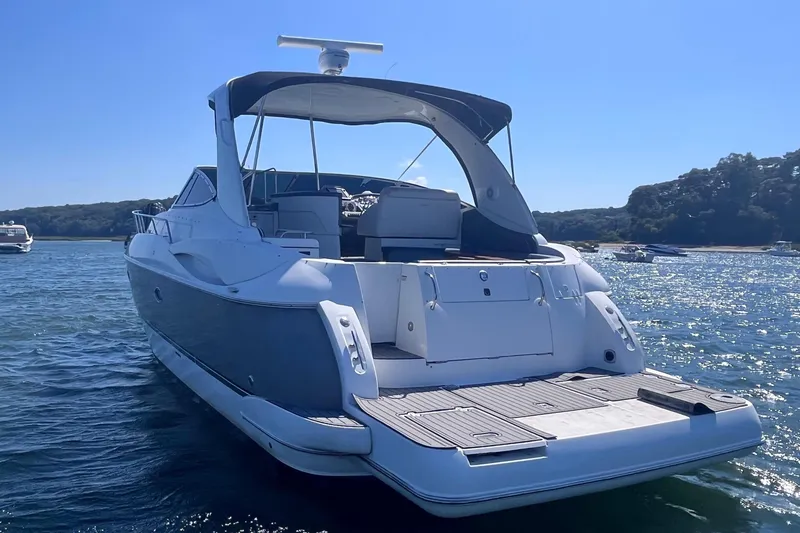 Slide: The Image of 2007 Cruisers Yachts 370 Express on water, rear view, sunny day. - 4