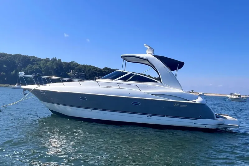 Slide: The Image of 2007 Cruisers Yachts 370 Express on calm water, clear sky background. - 5