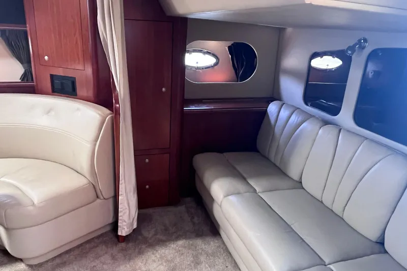 Slide: The Image of Interior of 2007 Cruisers Yachts 370 Express with leather seating and wood cabinetry. - 22