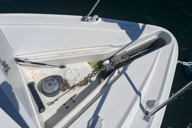 Slide: The Image of Anchor compartment of 2007 Cruisers Yachts 370 Express with chain and winch. - 29