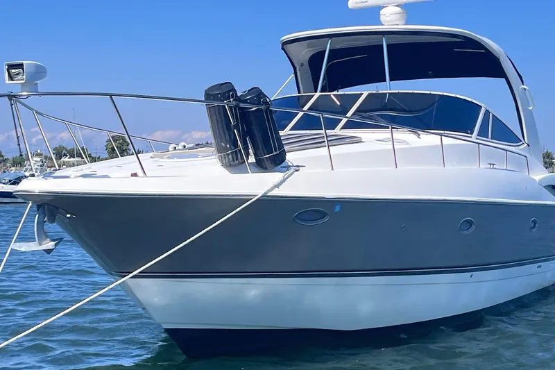 Slide: The Image of 2007 Cruisers Yachts 370 Express on water, sleek design, sunny day. - 3