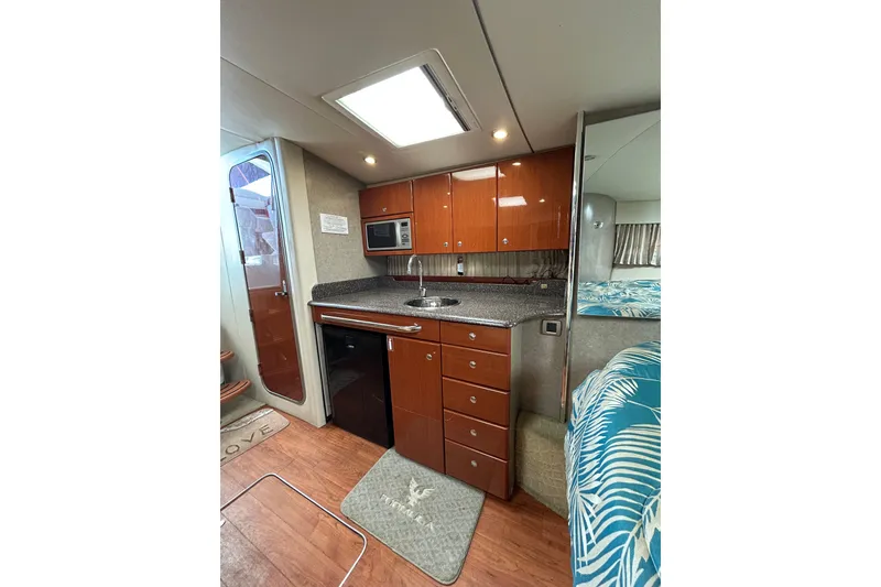 Slide: The Image of 2008 Formula 34 Performance Cruiser interior storage compartment with open door. - 15