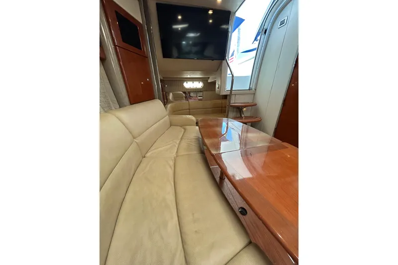 Slide: The Image of Luxurious interior of 2008 Formula 34 Performance Cruiser with leather seating and wooden table. - 24