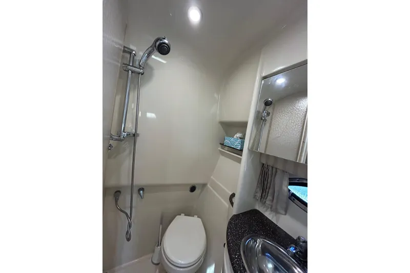 Slide: The Image of 2008 Formula 34 Performance Cruiser bathroom with sink, mirror, and toilet. - 28
