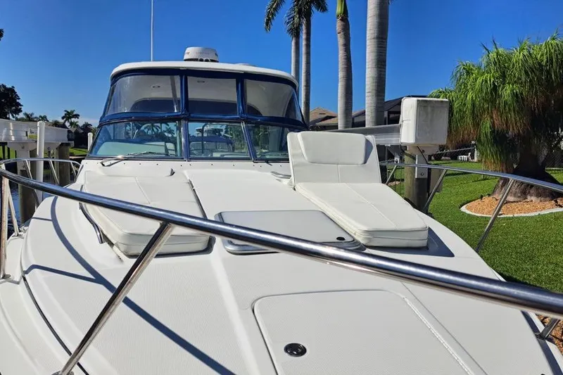 Slide: The Image of 2008 Formula 34 Performance Cruiser interior with white seating and blue accents. - 36