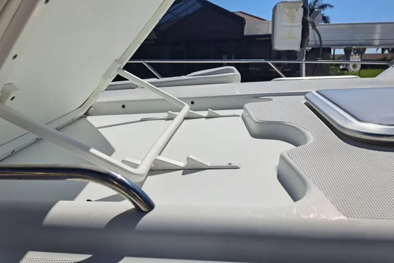 Slide: The Image of 2008 Formula 34 Performance Cruiser docked, featuring sleek design and sunbathing area. - 37