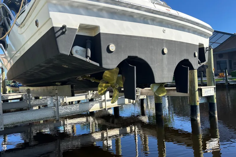 Slide: The Image of 2008 Formula 34 Performance Cruiser docked, rear view with blue canopy, Cape Coral, FL. - 40
