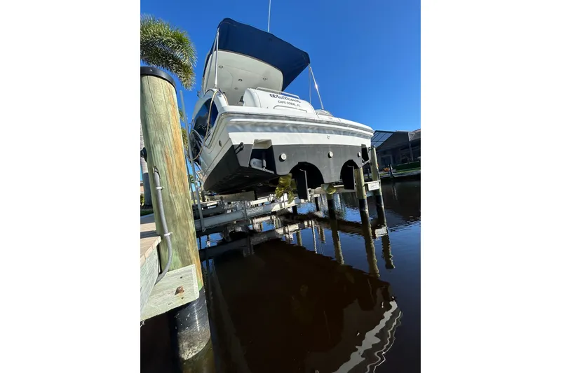 Slide: The Image of 2008 Formula 34 Performance Cruiser on lift, showcasing propellers and hull design. - 41