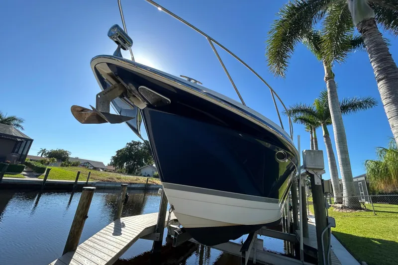 Slide: The Image of 2008 Formula 34 Performance Cruiser docked, rear view, sunny day, calm water. - 42