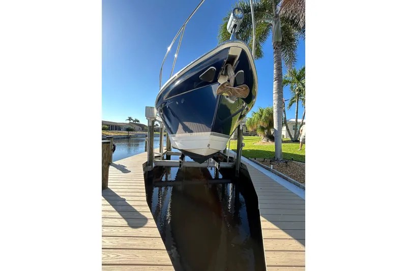 Slide: The Image of 2008 Formula 34 Performance Cruiser on lift, sunny day, palm trees in background. - 43