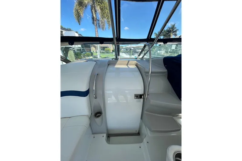 Slide: The Image of 2008 Formula 34 Performance Cruiser seating area with dual tables, white and blue upholstery. - 52