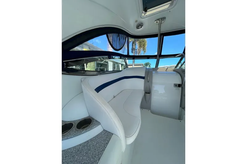 Slide: The Image of Interior of 2008 Formula 34 Performance Cruiser with white seating and blue accents. - 54