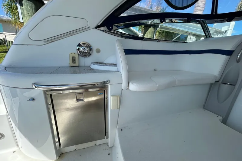 Slide: The Image of Interior of 2008 Formula 34 Performance Cruiser with white seating and blue accents. - 55