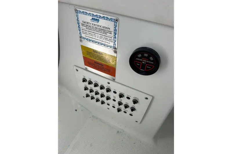 Slide: The Image of Control panel of a 2008 Formula 34 Performance Cruiser with labeled switches and buttons. - 68