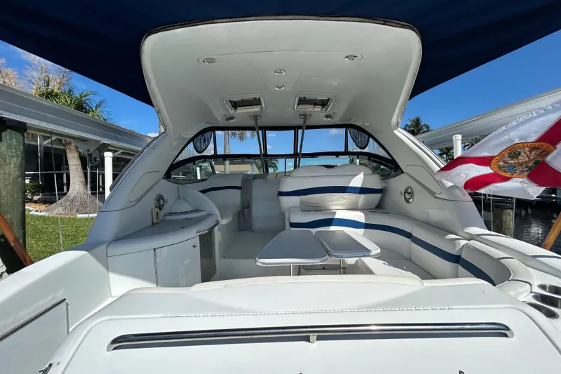 Slide: The Image of 2008 Formula 34 Performance Cruiser with open storage, life ring, and ropes by the water. - 74