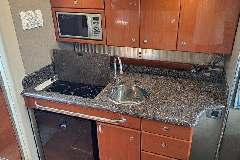 Slide: The Image of Luxurious interior of 2008 Formula 34 Performance Cruiser with modern amenities and elegant design. - 8