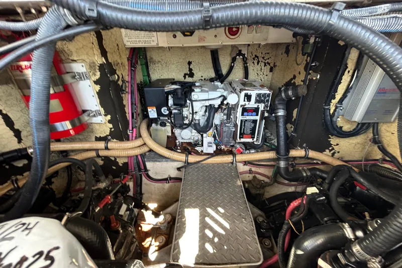 Slide: The Image of Engine compartment of a 2008 Formula 34 Performance Cruiser with visible wiring and components. - 80