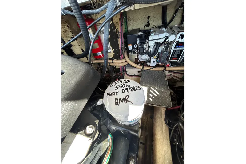 Slide: The Image of Engine compartment of a 2008 Formula 34 Performance Cruiser with maintenance notes. - 81