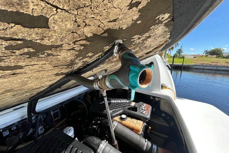 Slide: The Image of Engine compartment of a 2008 Formula 34 Performance Cruiser with visible Mercury engine components. - 82