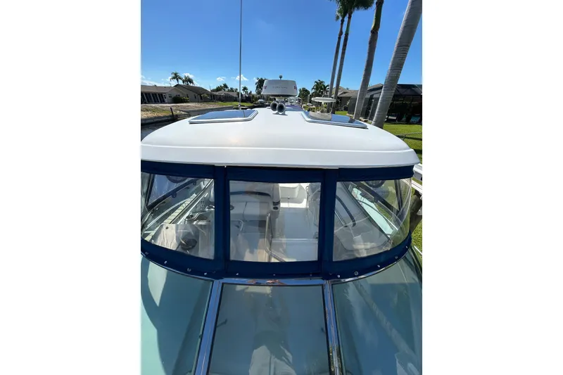 Slide: The Image of 2008 Formula 34 Performance Cruiser boat docked under clear blue sky. - 83