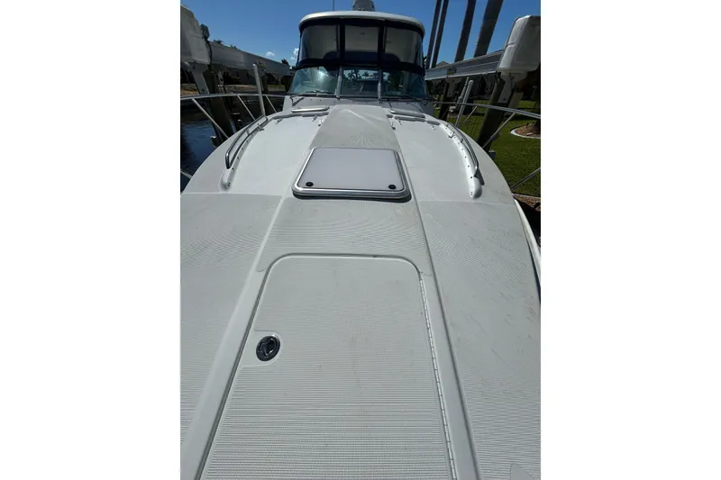 Slide: The Image of 2008 Formula 34 Performance Cruiser boat deck, sleek design, docked under clear sky. - 85
