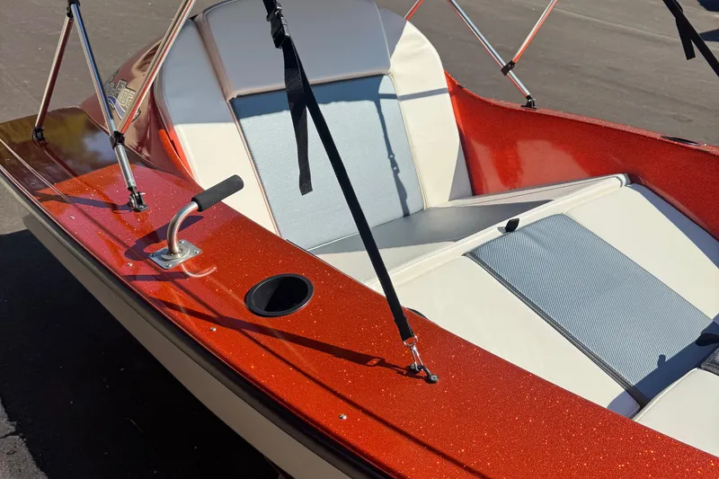 Slide: The Image of 2025 Go-Float Vortex boat with red metallic finish and white seating. - 4