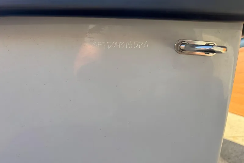 Slide: The Image of Close-up of Go-Float Vortex 2025 boat hull with engraved serial number. - 6