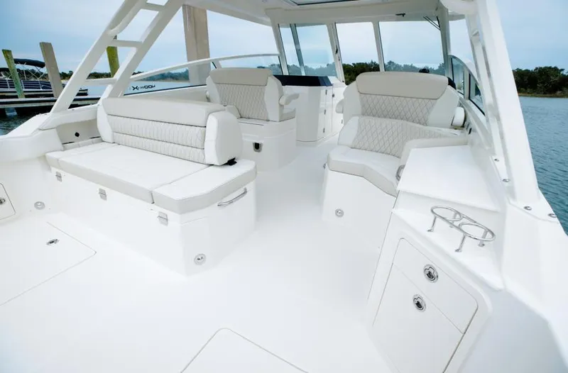 Slide: The Image of 2026 World Cat 400DC-X Island boat interior with luxurious white seating and modern design. - 4