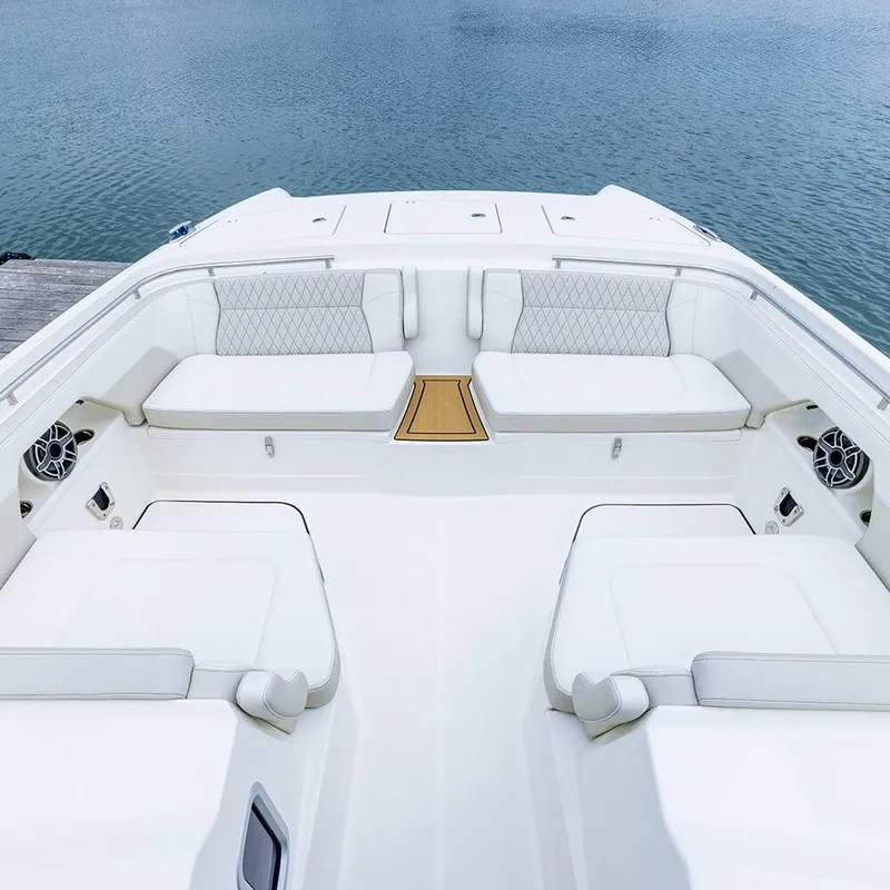 Slide: The Image of Luxurious seating area on 2026 World Cat 400DC-X Island boat, overlooking serene water. - 6
