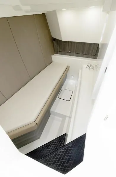 Slide: The Image of 2026 World Cat 400DC-X Island interior cabin with modern seating and sleek design. - 8