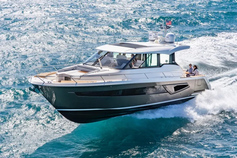 The Image of 2025 Tiara Yachts EX 54 cruising on open water, showcasing sleek design and luxury. - 0