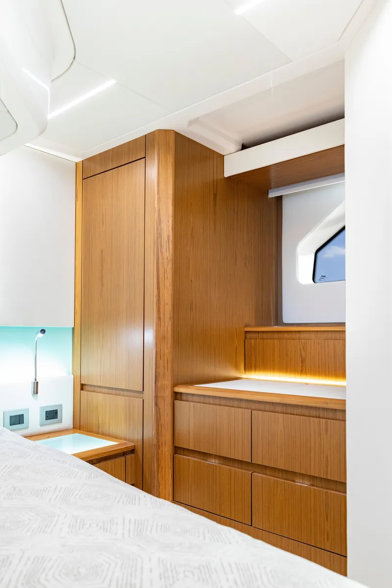 Slide: The Image of Luxurious interior of 2025 Tiara Yachts EX 54 with sleek wood cabinetry. - 39