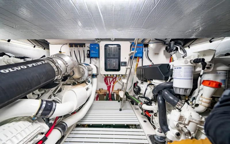 Slide: The Image of Engine room of 2025 Tiara Yachts EX 54, featuring advanced mechanical systems. - 48
