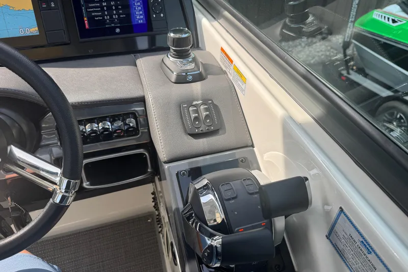 Slide: The Image of 2020 Formula 330 Crossover Bowrider with open storage compartment, showcasing interior seating. - 13