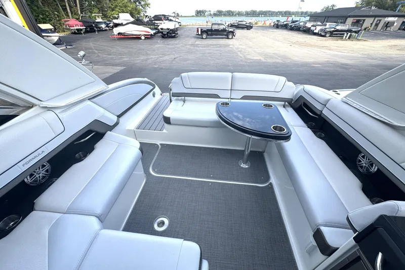 Slide: The Image of 2020 Formula 330 Crossover Bowrider interior bathroom with modern fixtures and porthole windows. - 17