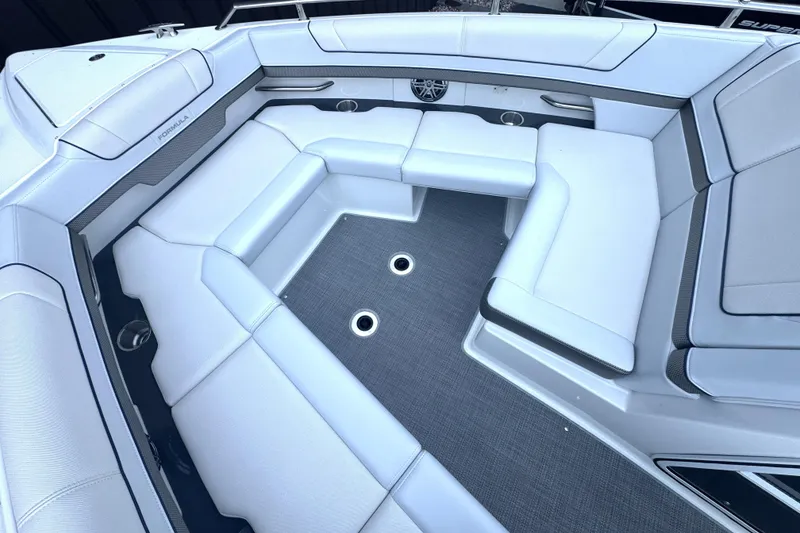 Slide: The Image of Storage compartment in 2020 Formula 330 Crossover Bowrider with coiled hose and accessories. - 19