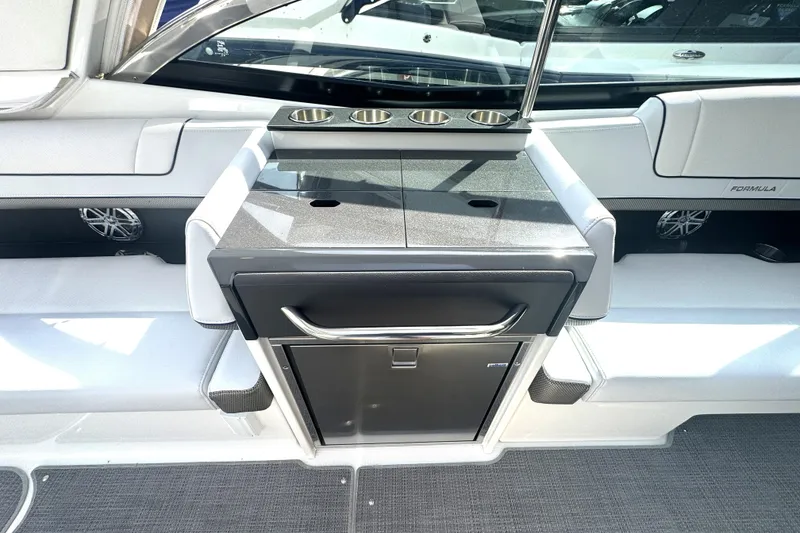 Slide: The Image of 2020 Formula 330 Crossover Bowrider with spacious white seating and sleek design. - 24