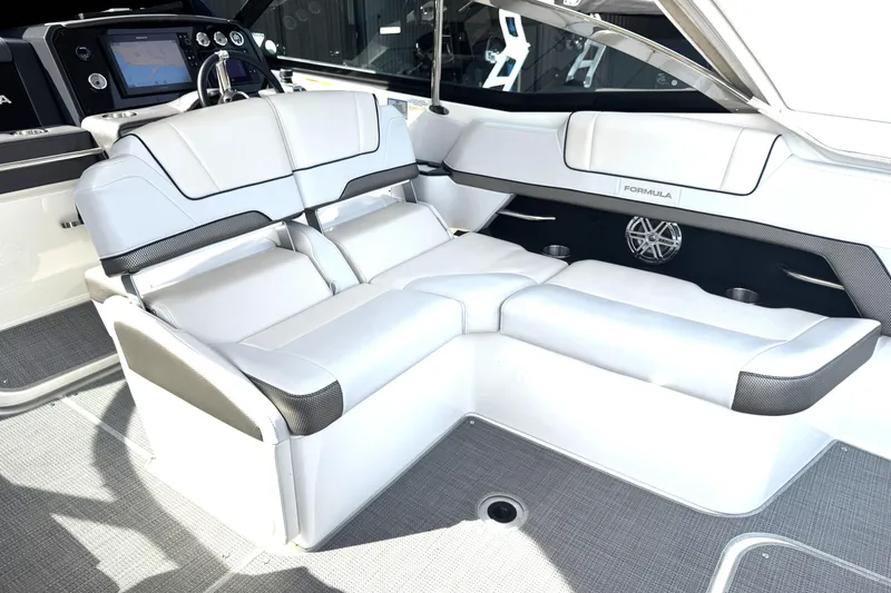 Slide: The Image of 2020 Formula 330 Crossover Bowrider boat on display, rear view with dual propellers. - 3