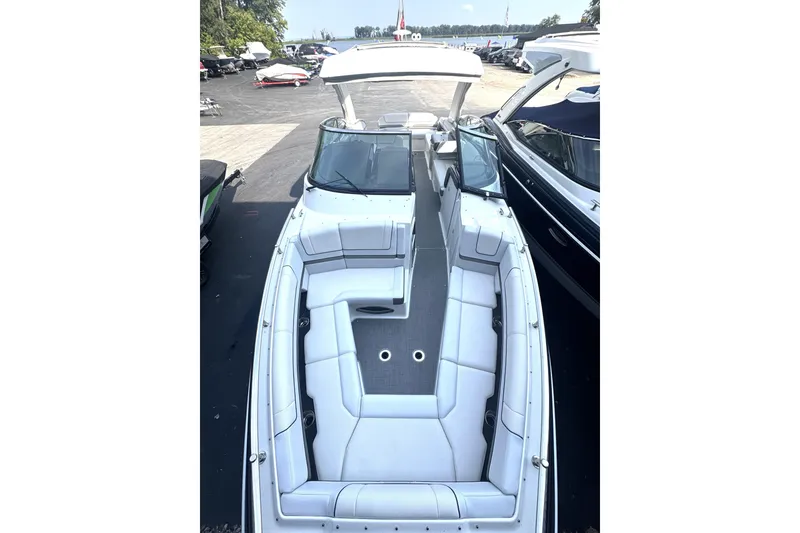 Slide: The Image of 2020 Formula 330 Crossover Bowrider with spacious seating and sleek design. - 5