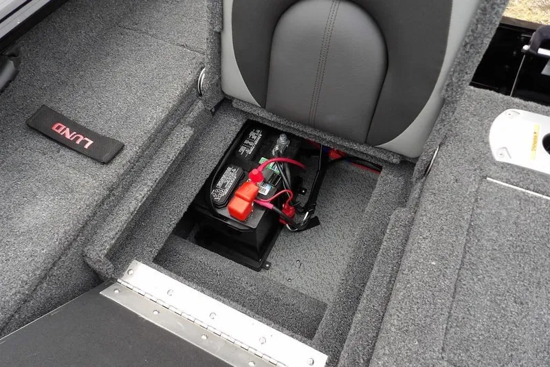 Slide: The Image of 2022 Lund 1875 Impact Sport boat interior with battery compartment. - 13