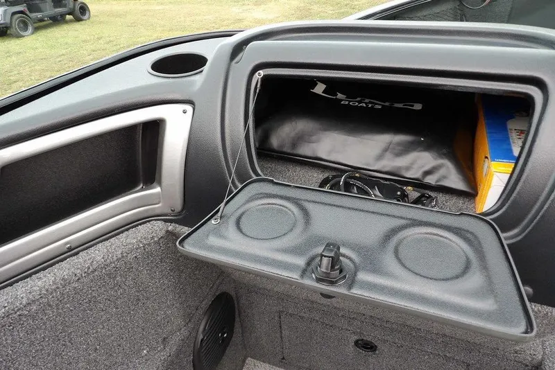 Slide: The Image of 2022 Lund 1875 Impact Sport boat interior storage compartment with accessories. - 21