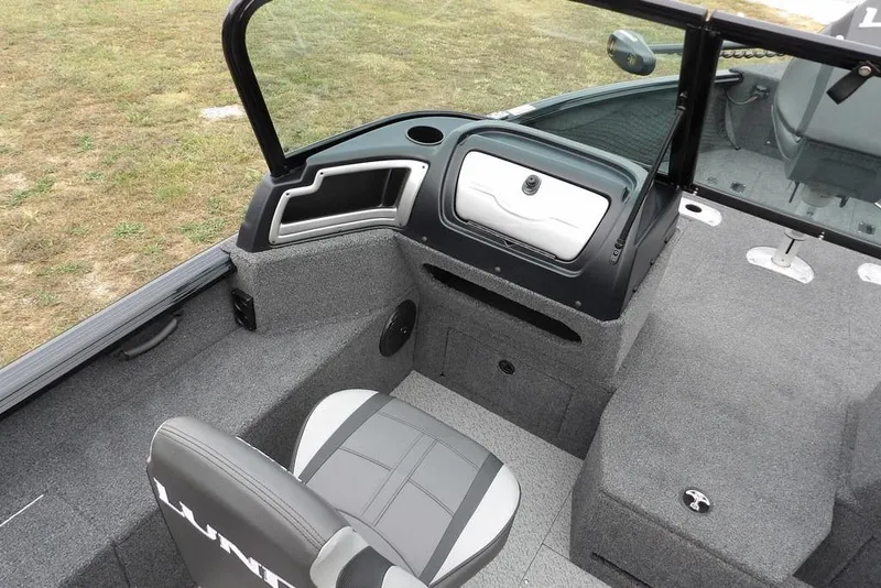Slide: The Image of 2022 Lund 1875 Impact Sport boat interior with seating and dashboard. - 22