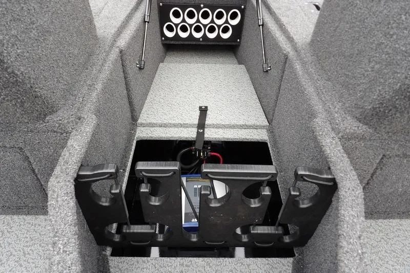 Slide: The Image of 2022 Lund 1875 Impact Sport boat interior with rod holders and storage compartment. - 29