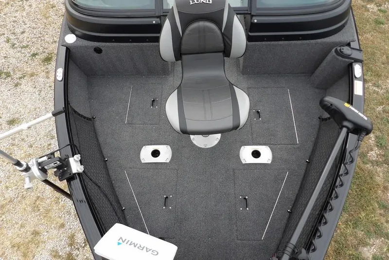 Slide: The Image of 2022 Lund 1875 Impact Sport boat interior with seating and fishing equipment. - 31