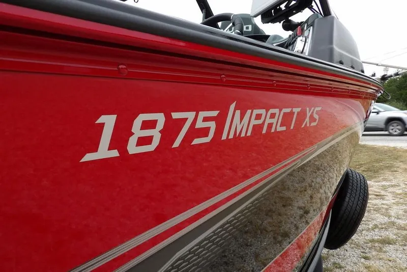 Slide: The Image of Red 2022 Lund 1875 Impact Sport boat with visible model name on the side. - 48